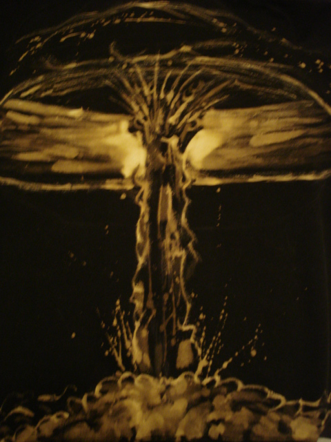 Bleach-painted mushroom cloud rising from a dark shirt