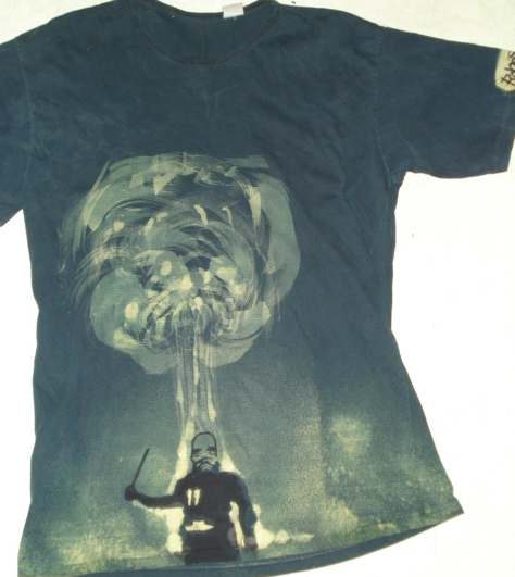 Bleach-painted shirt depicting a figure beneath a mushroom-cloud form