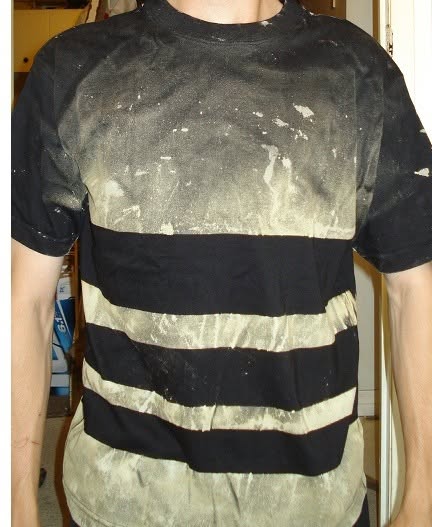 Black T-shirt bleach-painted with broad horizontal stripes and a faded upper field