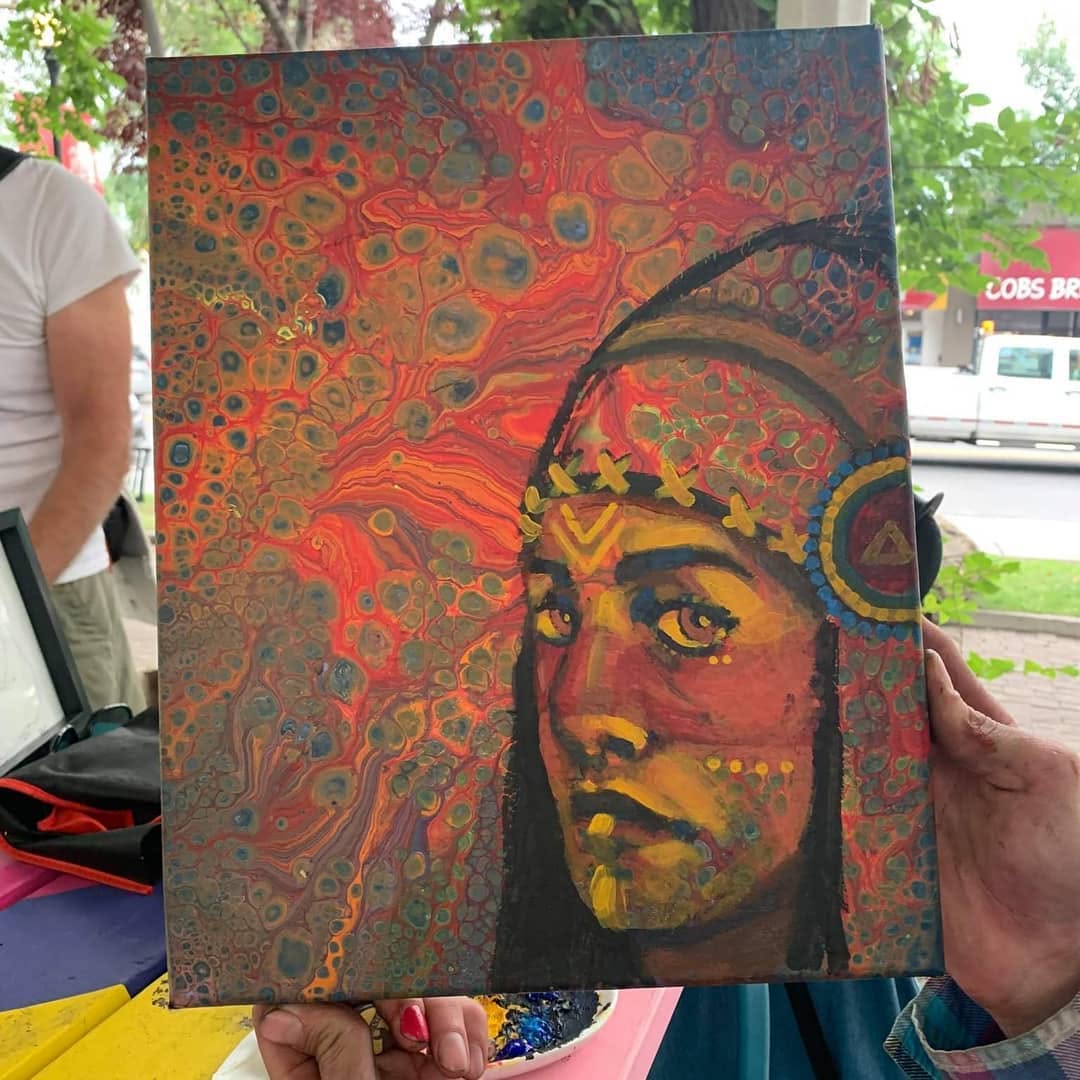 Portrait painted over an orange, red and teal acrylic-pour background